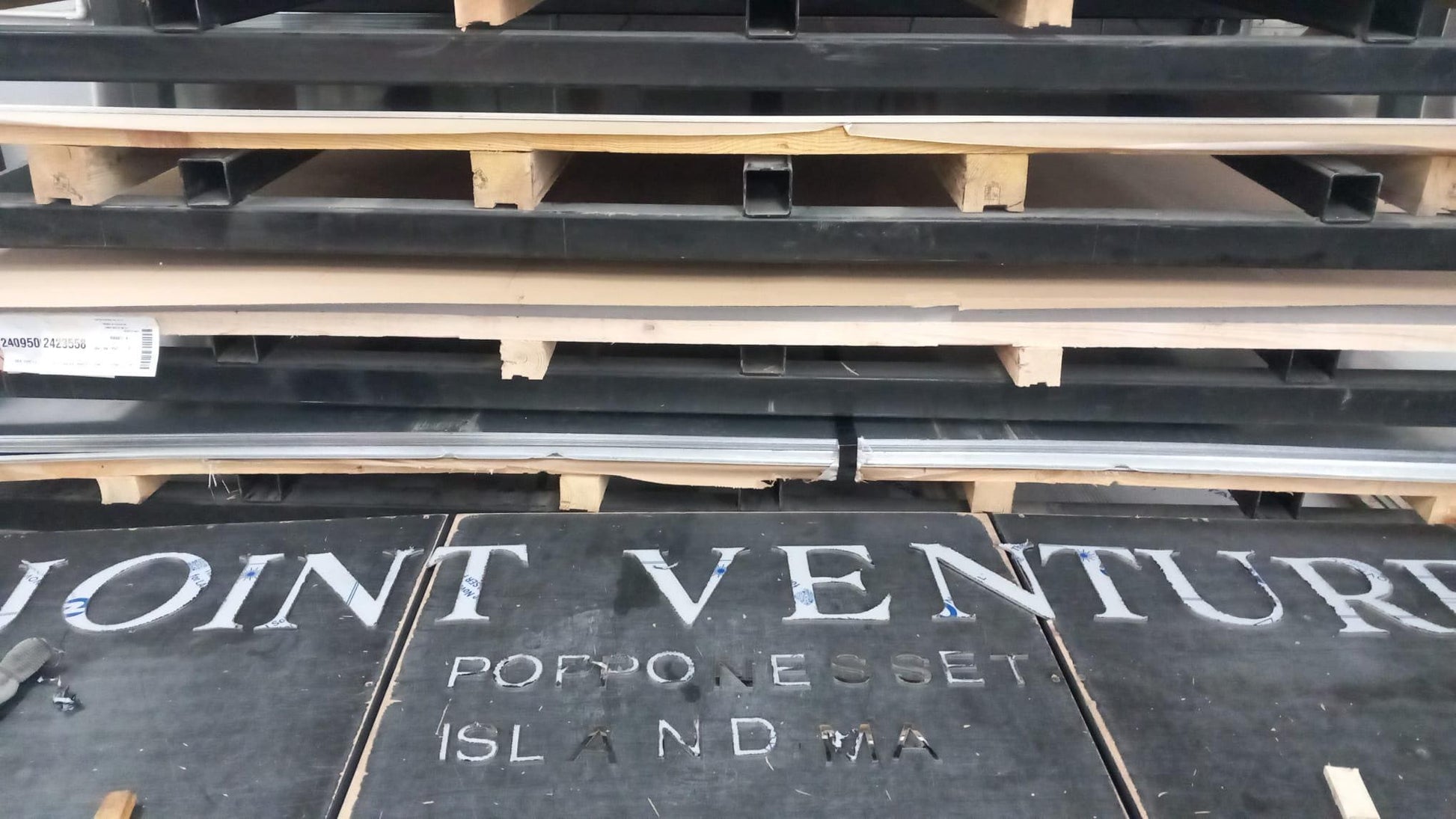 CNC laser-cut stainless steel boat numbers installed on hull